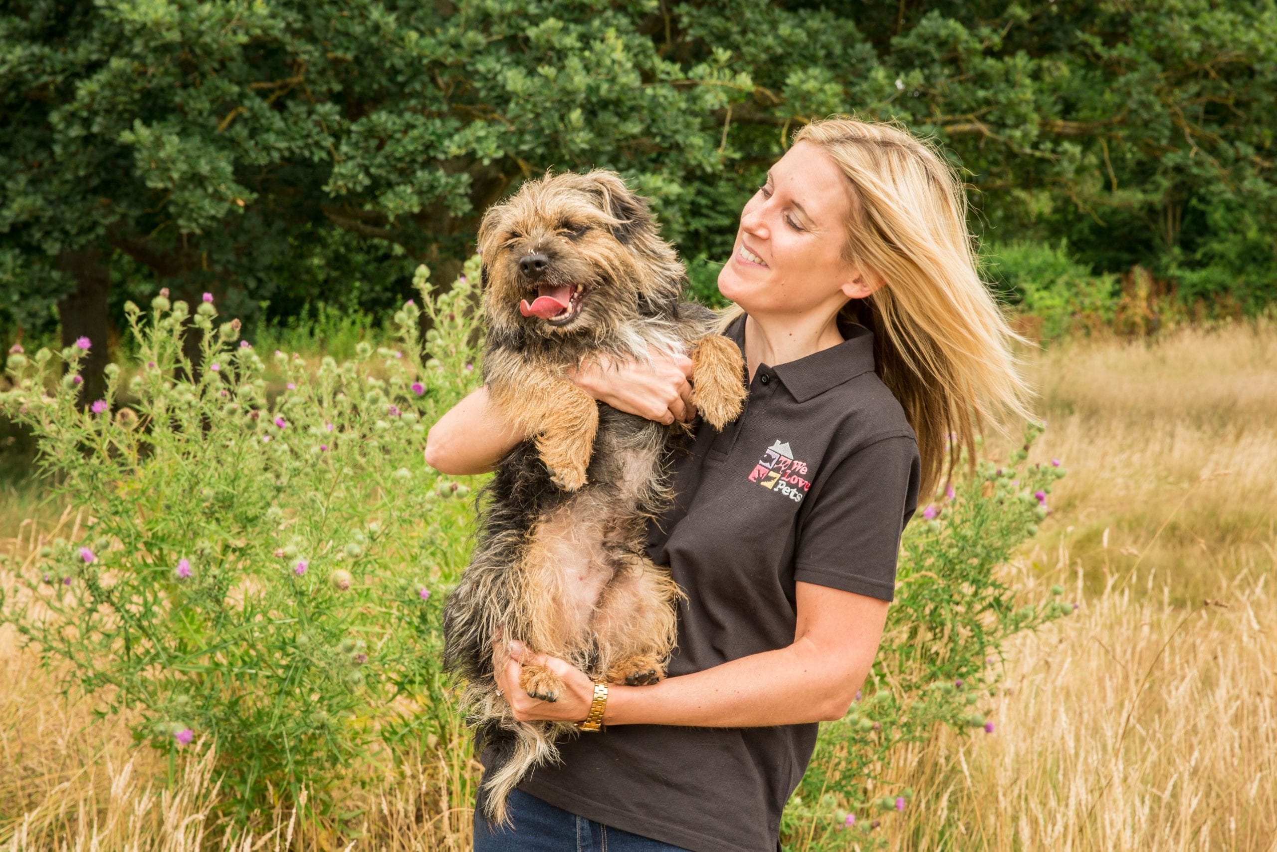 Jenny from We Love Pets Wimbledon holding a dog