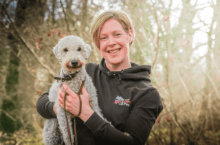 Tracey from We Love Pets Reading holding a dog