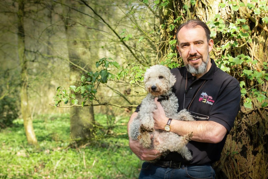 Carl from We Love Pets Wellingborough holding a dog