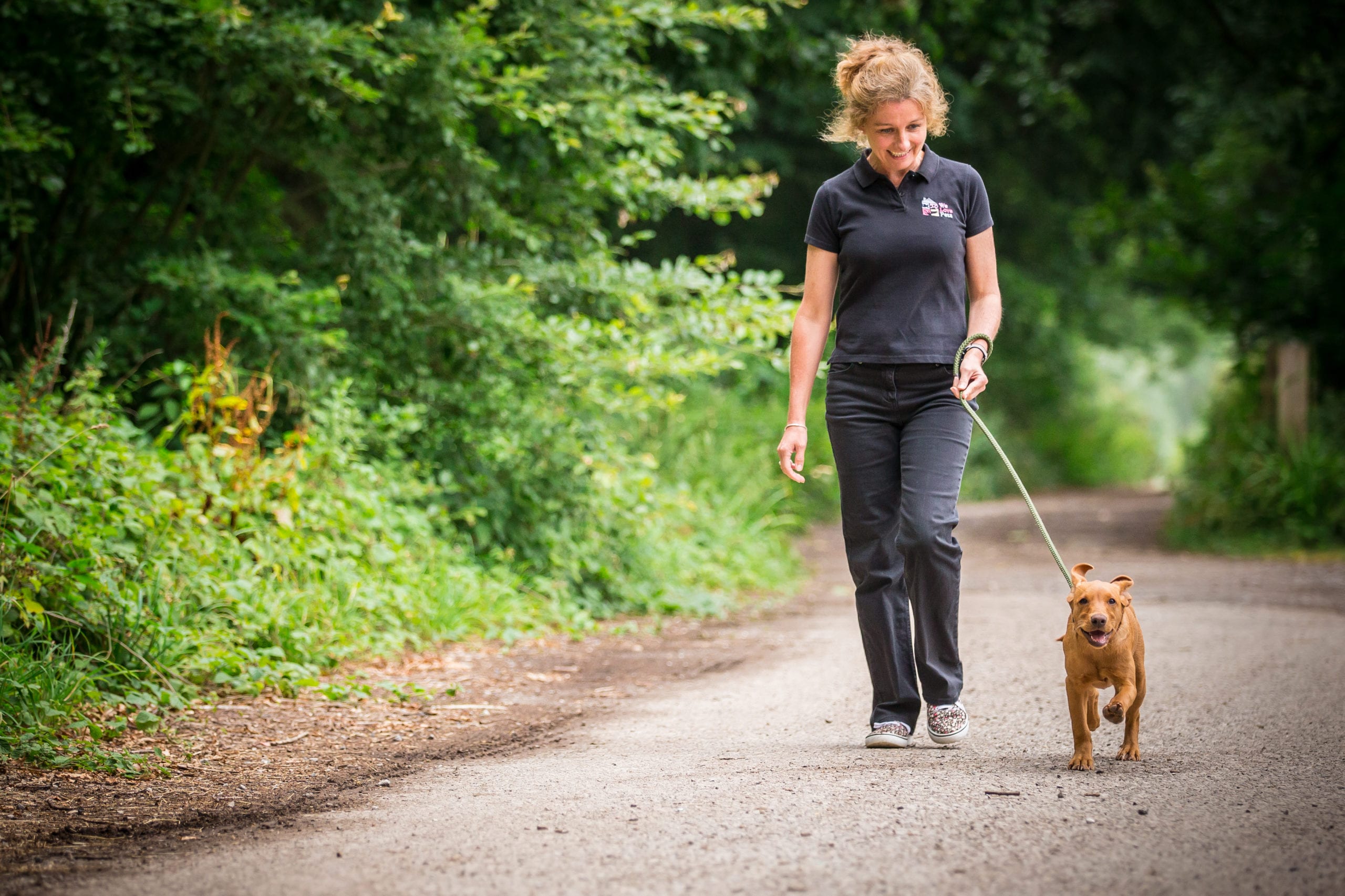 Sophie from We Love Pets Stroud walking a dog