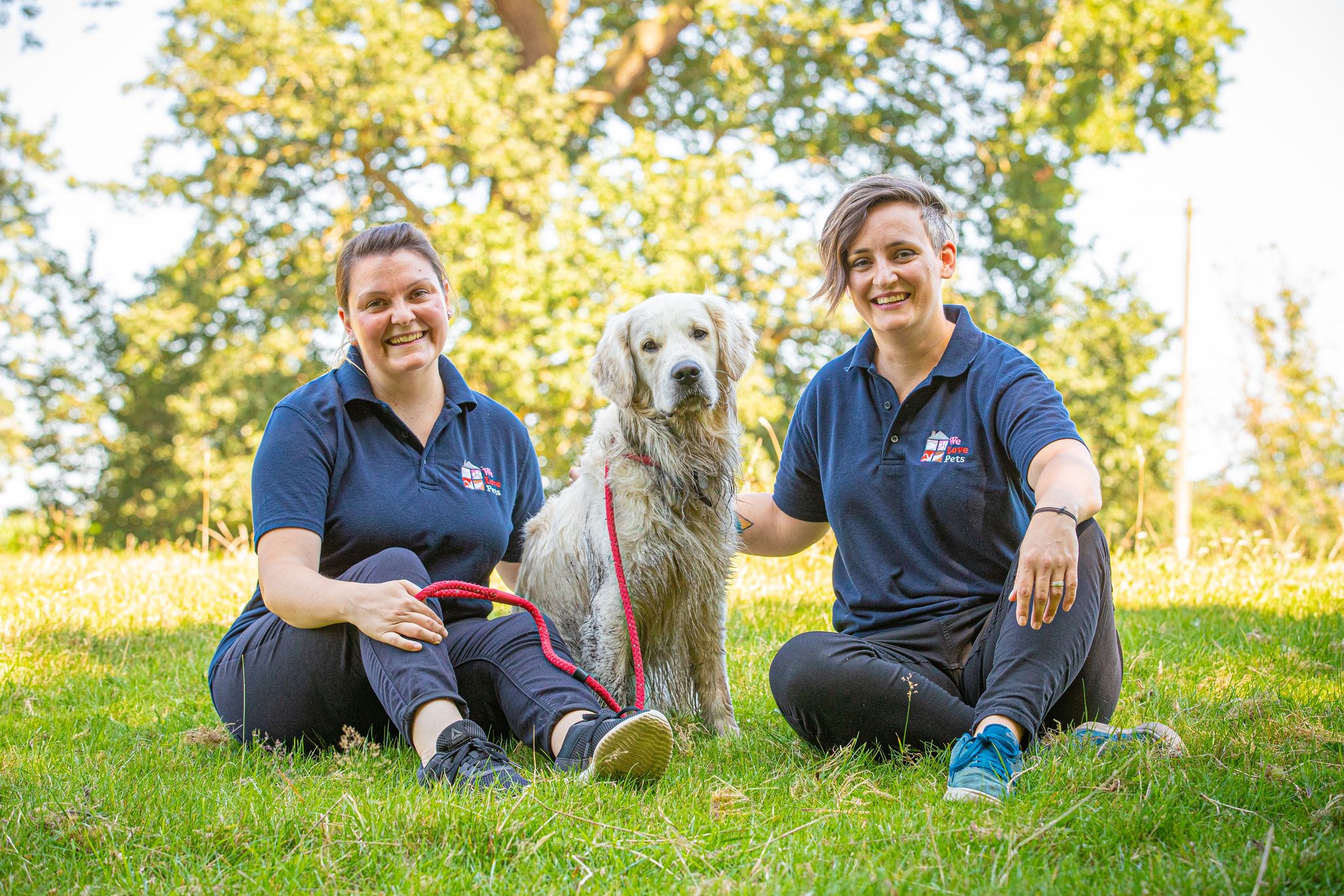 Two woman from We Love Pets Wycombe and a dog sitting