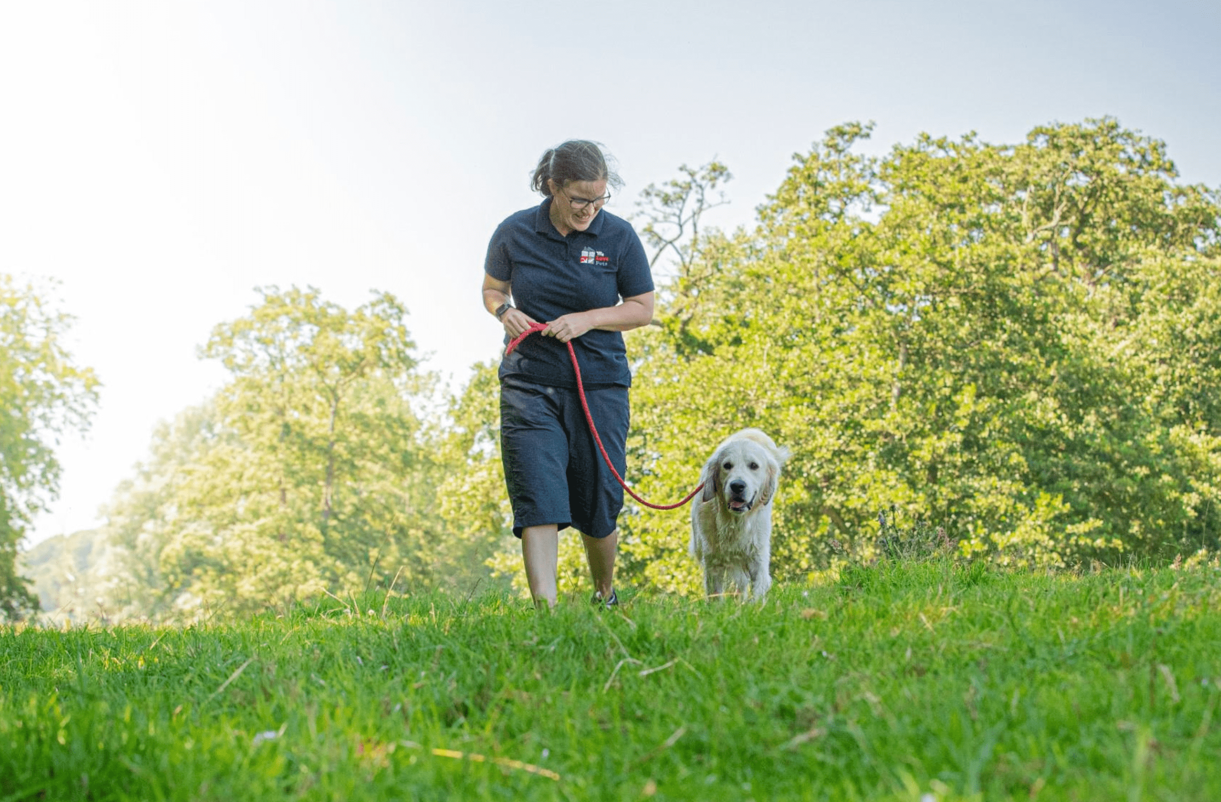 Rachel from We Love Pets Oakham walking dog on lead