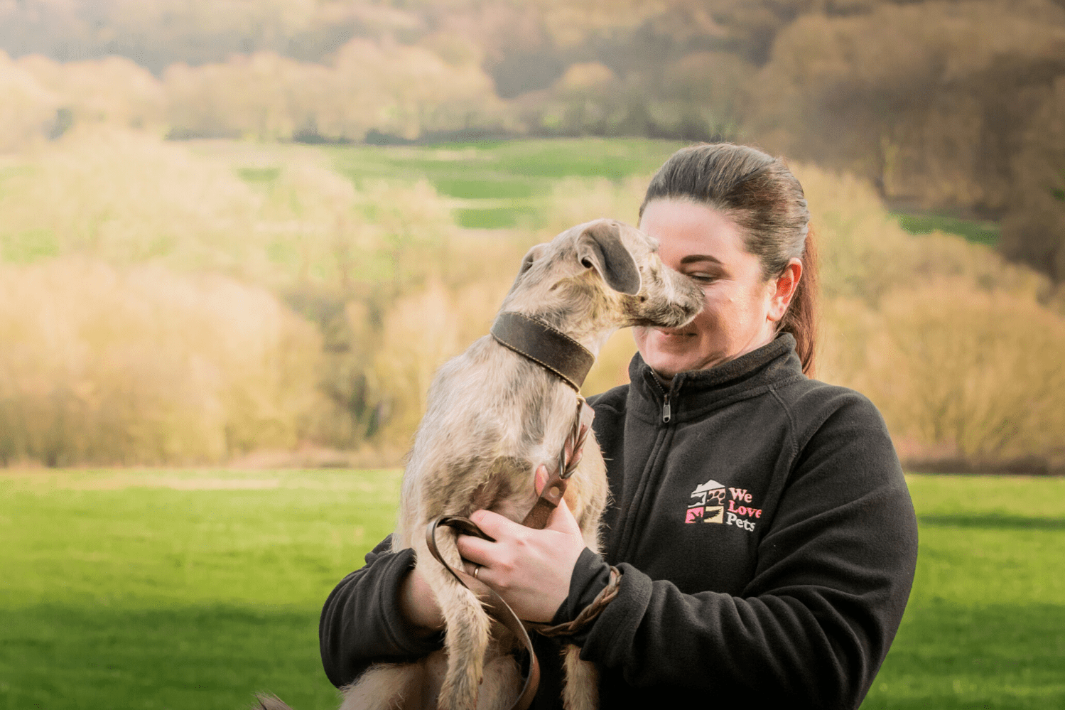 Robyn from We Love Pets Pendle holding a dog