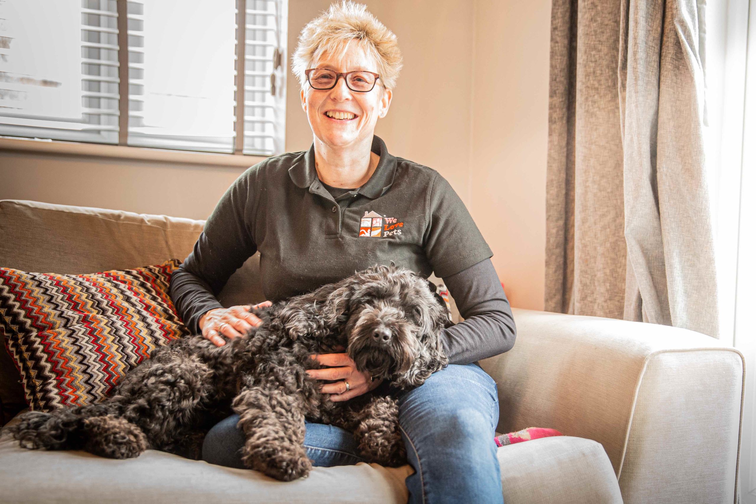 Viv with a dog in her lap