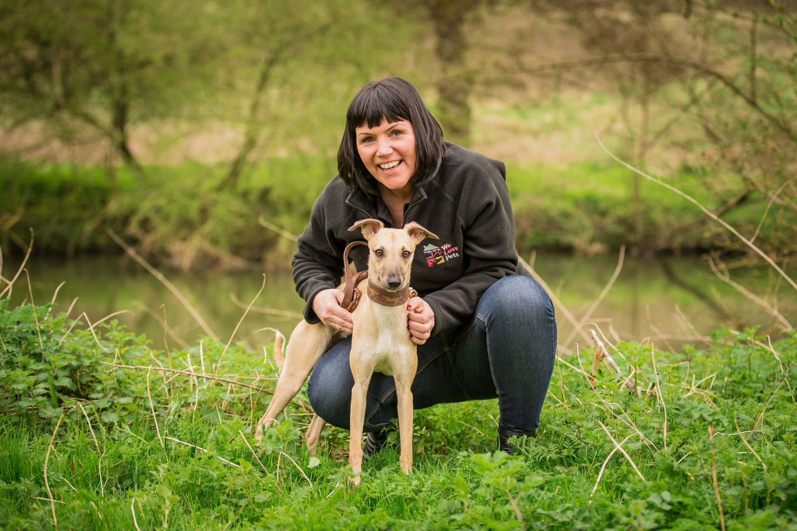 Caroline from We Love Pets Preston holding a dog