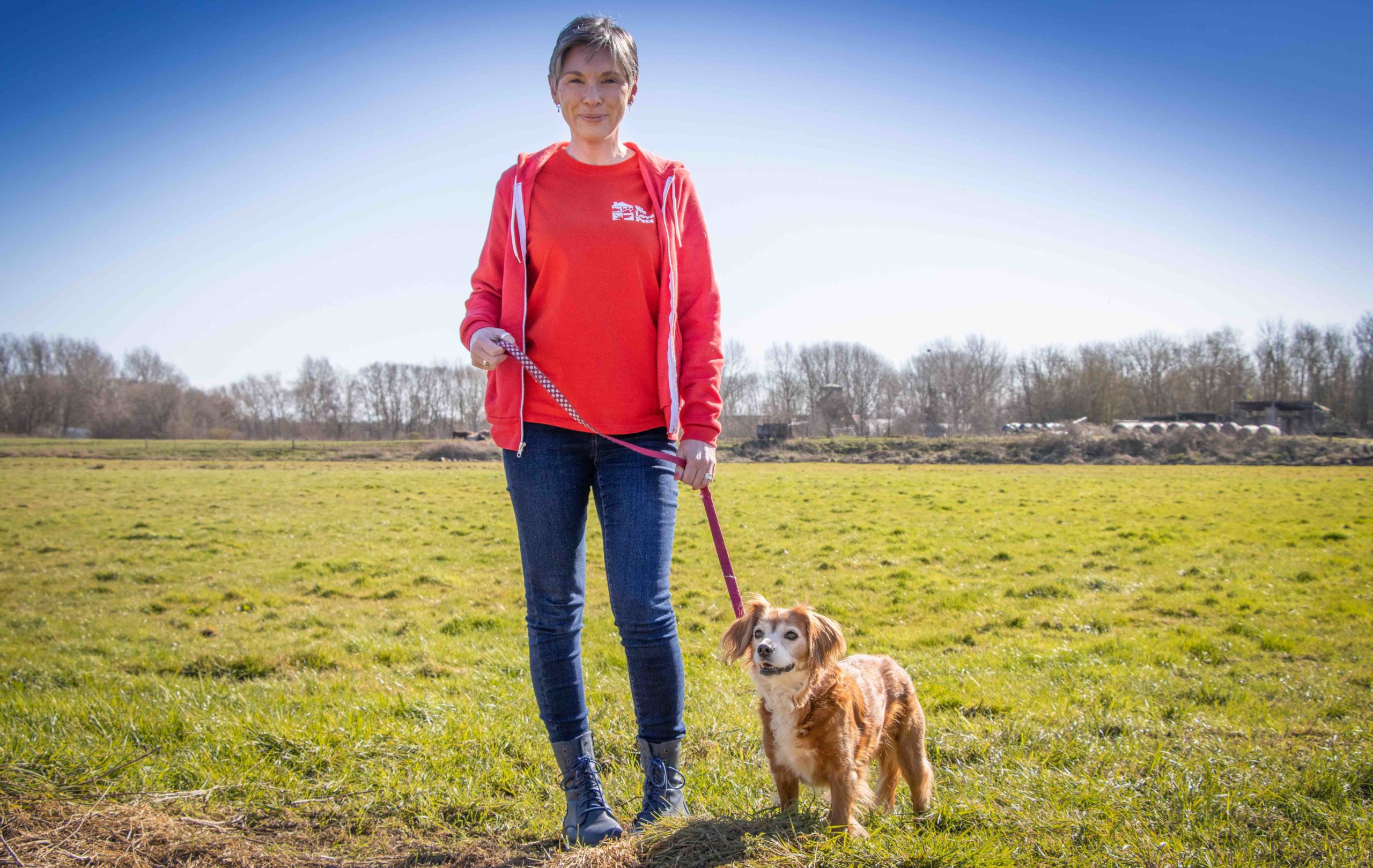 Deb Kiedis from We Love Pets Hereford holding dog